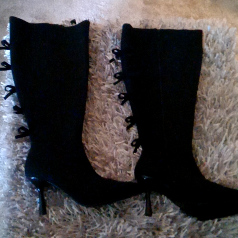 Torrid knee high black stilletto boots with bow accent
